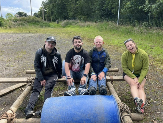 Group of adults on a barrel raft